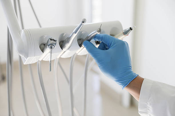 Professional Tooth Extraction technician working in Gulf Breeze, FL